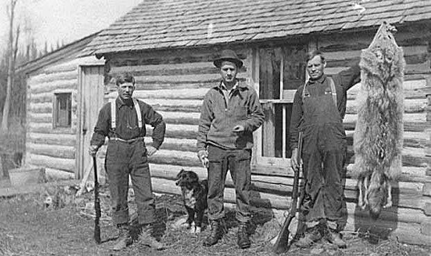 Hunters display wolf (?) pelt, ca. 1915.