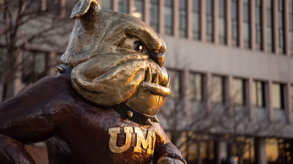 Gold UMD Mascot Champ statue on campus