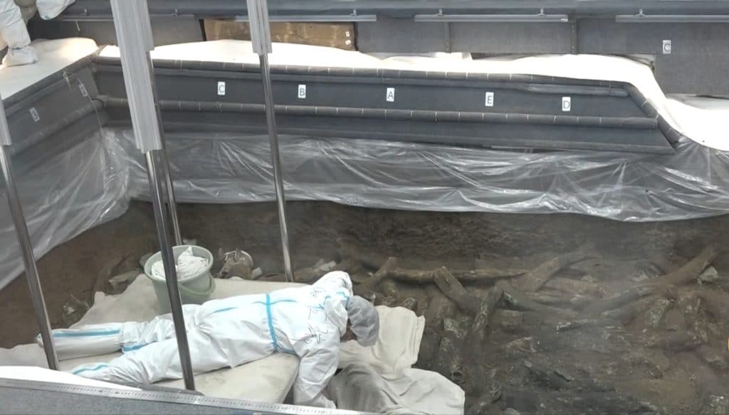 Archaeologist working in a pit of Sanxingdui
